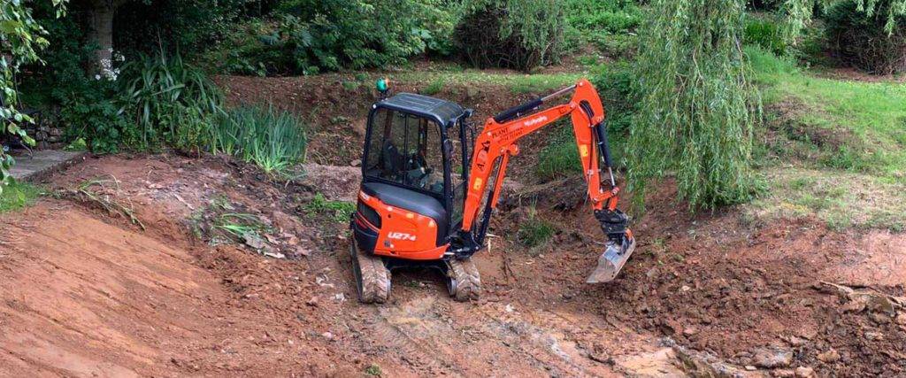 orange digger in mud